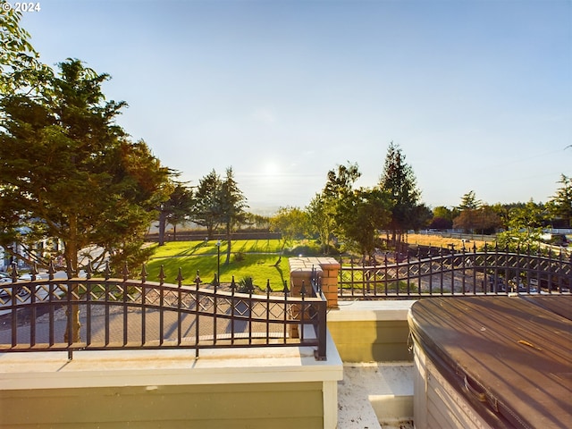 exterior space with a gate and a lawn