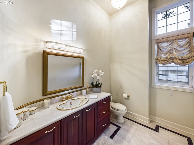 20417 SW Inglis Dr, Beaverton, OR 97007 - bathroom with baseboards, vanity, plenty of natural light, and tile patterned floors