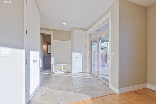 hall with light hardwood / wood-style flooring