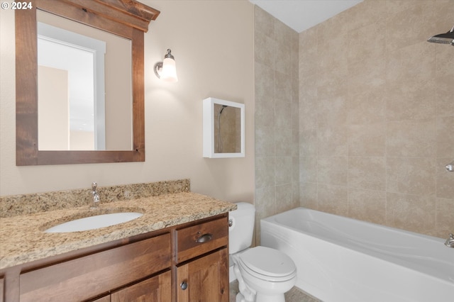 full bathroom with vanity, toilet, and tiled shower / bath combo