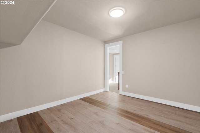 bonus room with light hardwood / wood-style flooring