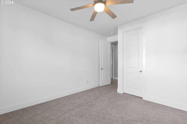 unfurnished bedroom with carpet and ceiling fan