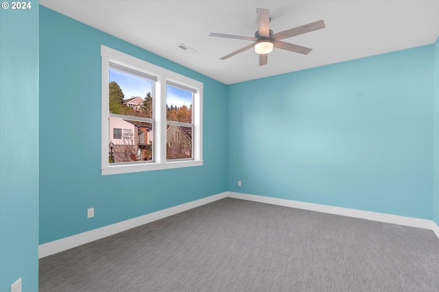 empty room with carpet flooring and ceiling fan