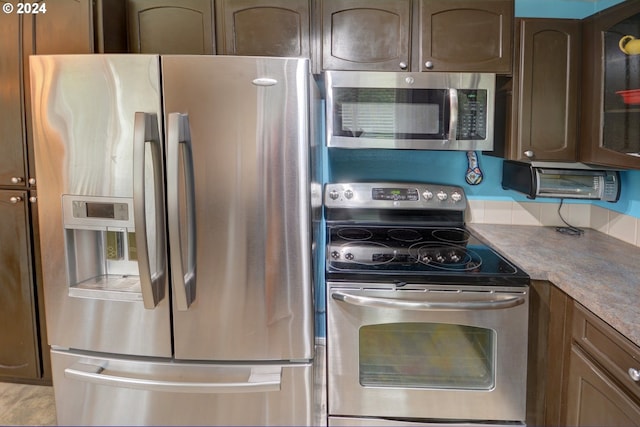 486 Ridge Dr, Gearhart, OR 97138 - kitchen with glass insert cabinets and stainless steel appliances