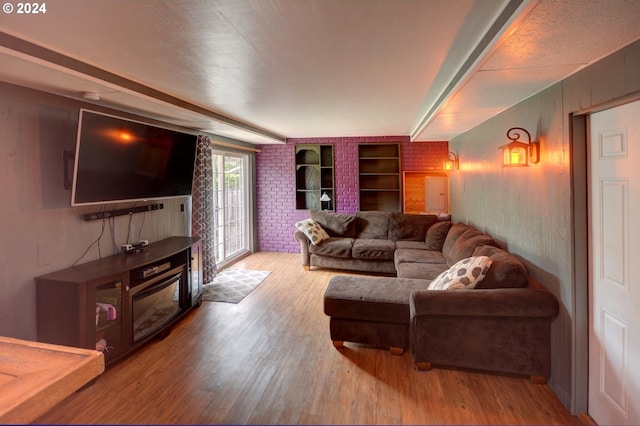 486 Ridge Dr, Gearhart, OR 97138 - living room featuring wood finished floors and brick wall