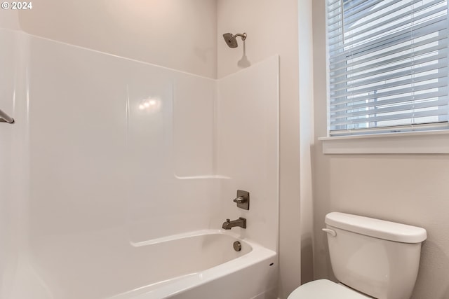 bathroom with toilet and shower / bath combination