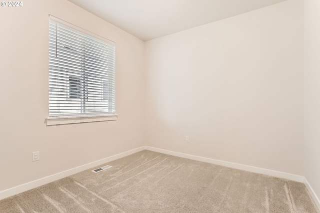 empty room with carpet flooring