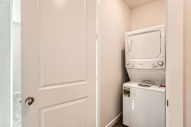 laundry area with stacked washer / dryer