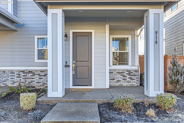 entrance to property featuring a porch