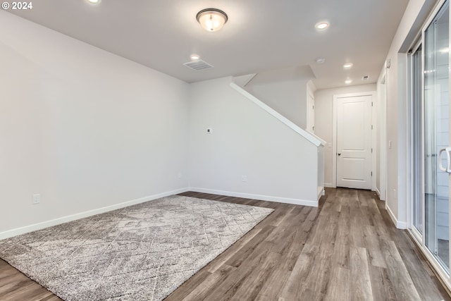 unfurnished room featuring hardwood / wood-style floors