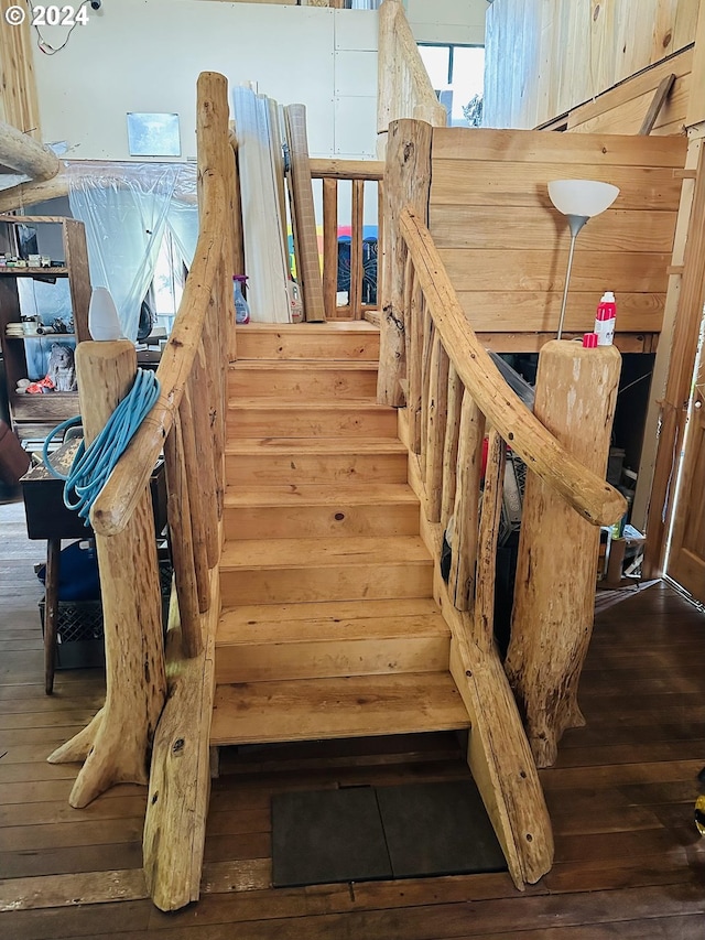 stairway featuring hardwood / wood-style flooring