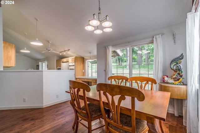 dining space featuring lofted ceiling, dark wood finished floors, and ceiling fan with notable chandelier