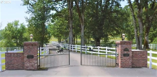 view of gate featuring fence