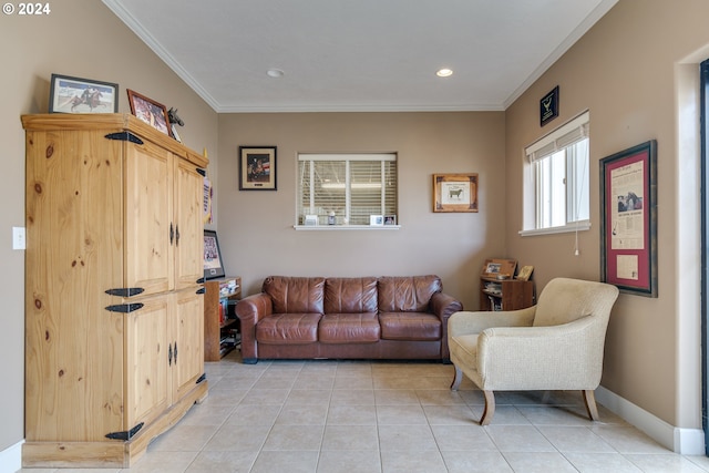 living room with light tile patterned floors, ornamental molding, and baseboards