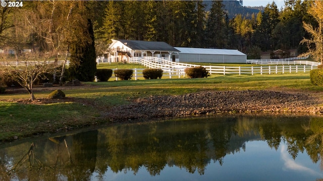 property view of water featuring fence