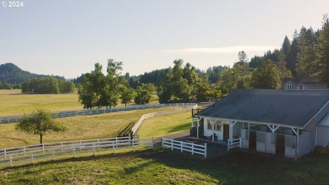 exterior space featuring an exterior structure, an outbuilding, and a rural view