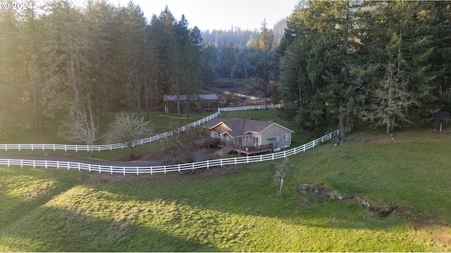 aerial view featuring a forest view and a rural view