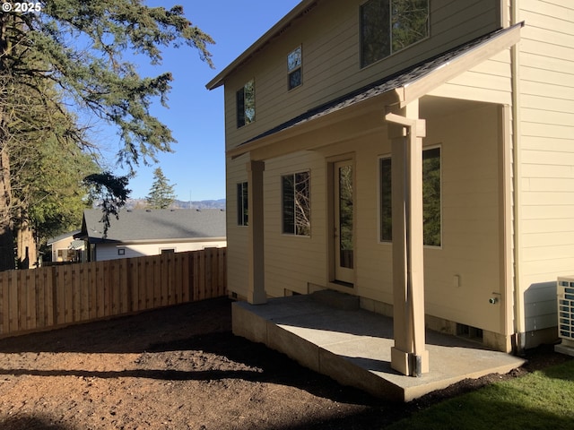 view of property exterior with a patio area