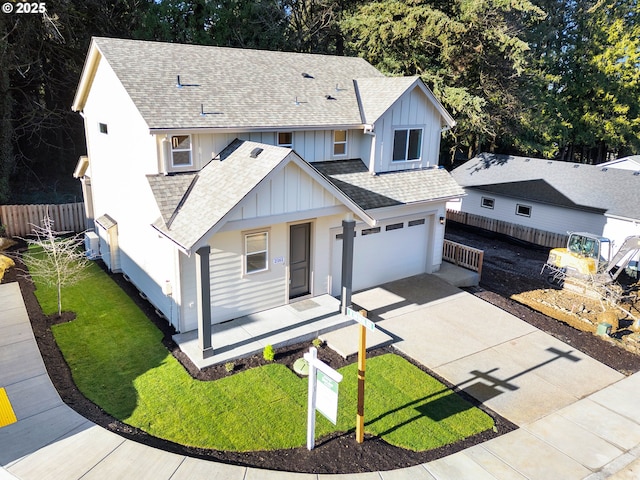 view of front facade with a garage and a front yard