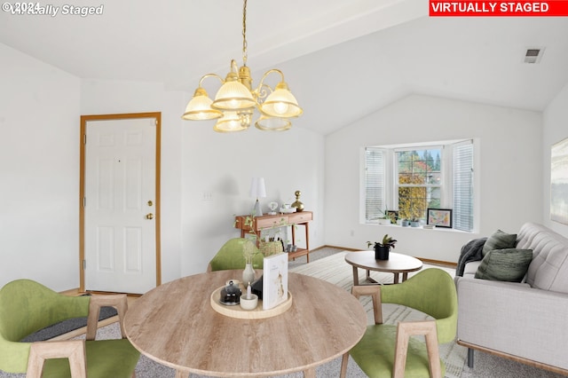 carpeted dining area featuring an inviting chandelier and lofted ceiling