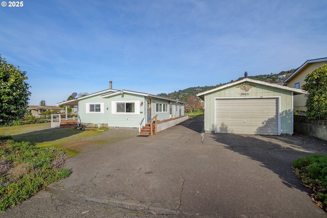 view of front of home with an outbuilding and a garage