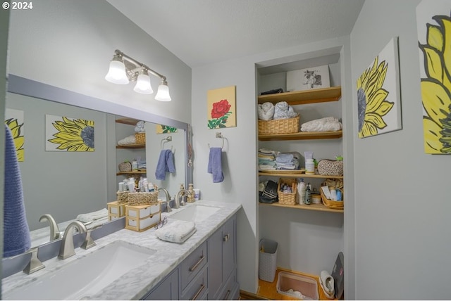 bathroom with vanity and a textured ceiling