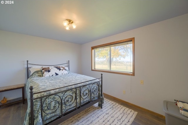 bedroom featuring dark hardwood / wood-style flooring