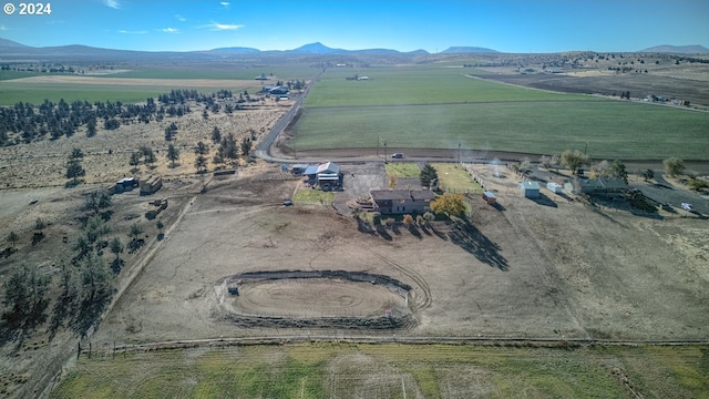 birds eye view of property featuring a mountain view and a rural view