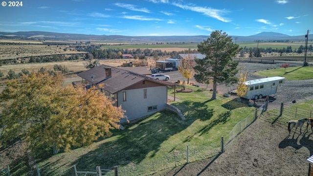 bird's eye view featuring a mountain view and a rural view