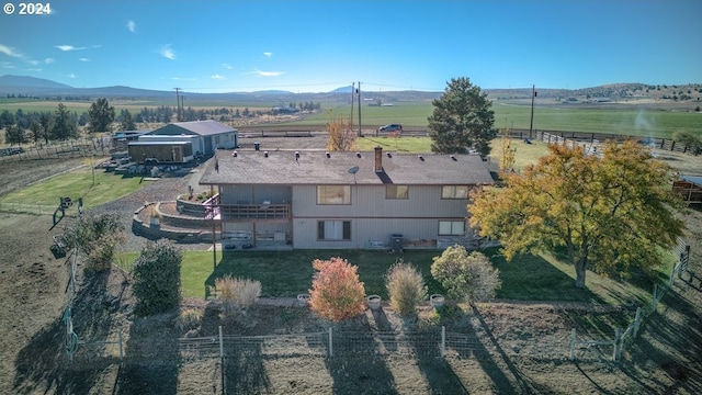 bird's eye view with a mountain view and a rural view