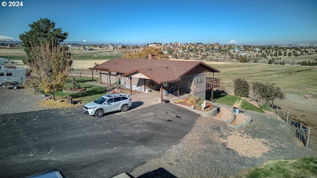 birds eye view of property featuring a rural view