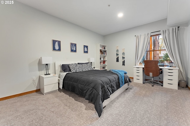 bedroom featuring light carpet