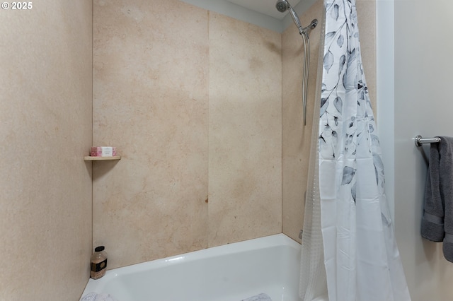 bathroom with shower / bath combination with curtain