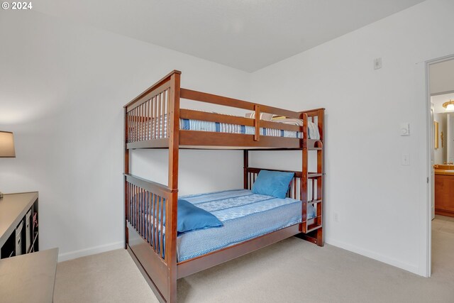 bedroom with light colored carpet