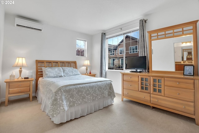 carpeted bedroom featuring a wall unit AC