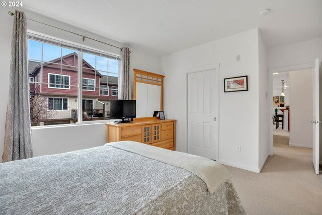 bedroom with light colored carpet