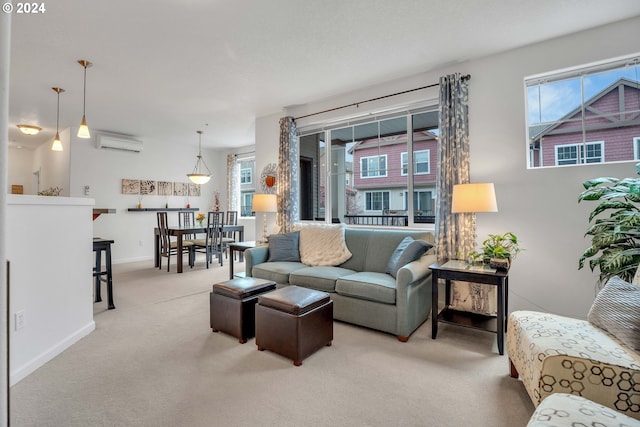 living room featuring carpet floors, baseboards, and a wall unit AC