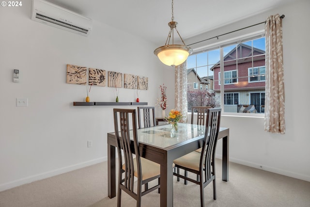 carpeted dining room with baseboards and a wall mounted air conditioner