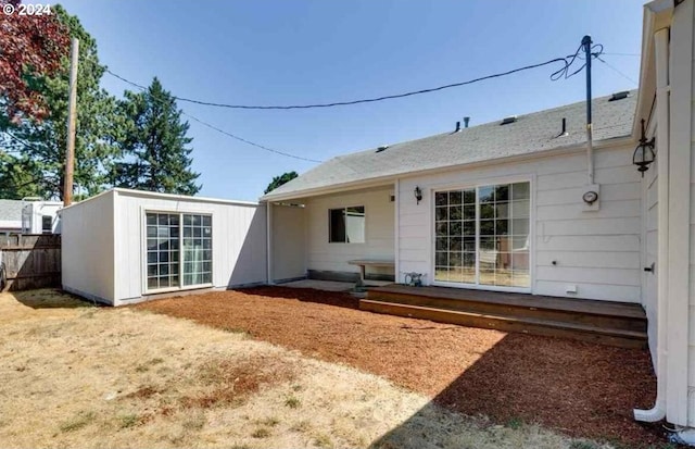 back of property with an outbuilding