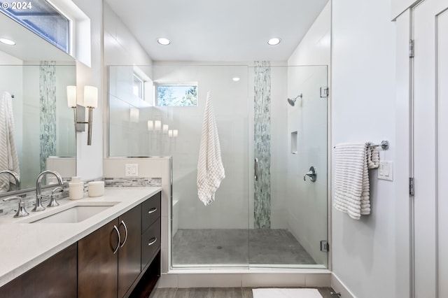 bathroom featuring vanity and walk in shower