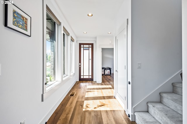 hall with light hardwood / wood-style floors