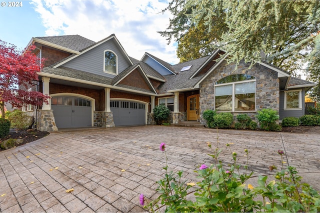 craftsman house with a garage