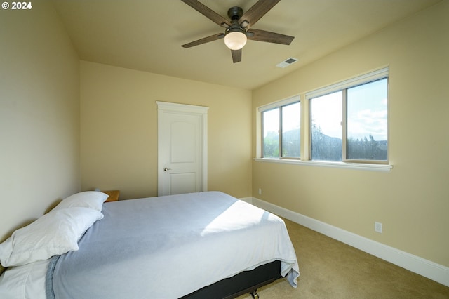 carpeted bedroom with ceiling fan