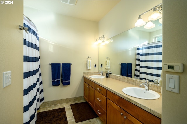 bathroom with vanity and walk in shower