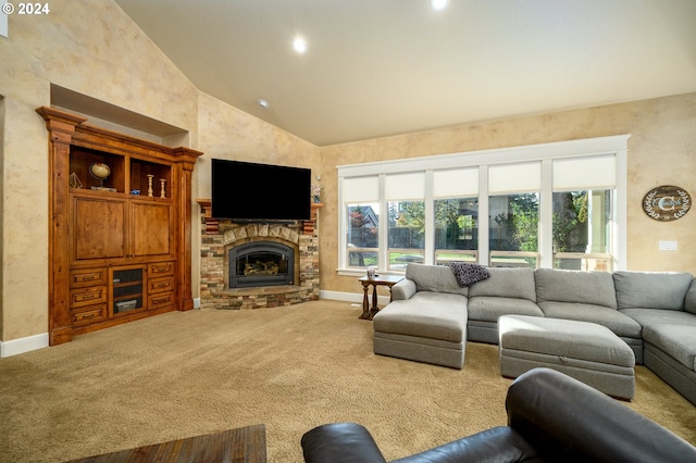 living room featuring a stone fireplace, high vaulted ceiling, carpet, and a wealth of natural light