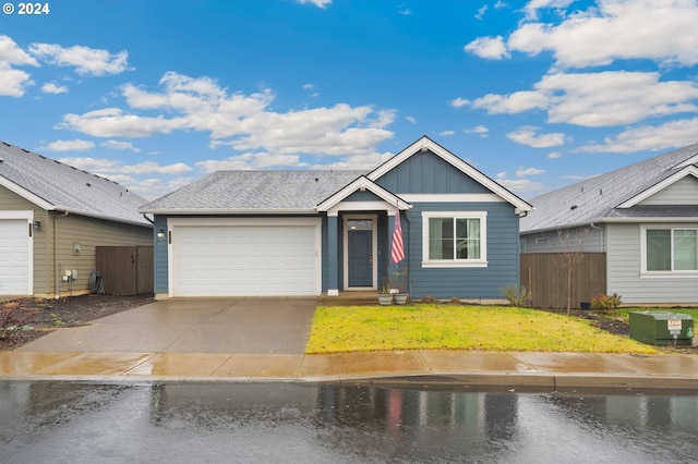 view of front of house featuring a garage and a front yard