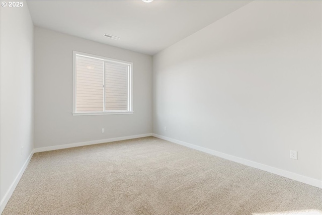 unfurnished room featuring carpet