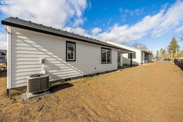 back of house featuring cooling unit