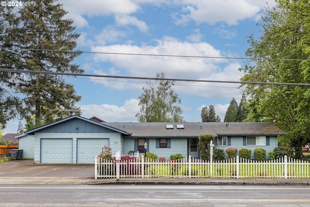 single story home featuring a garage