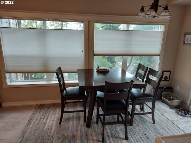 dining area featuring carpet flooring and plenty of natural light